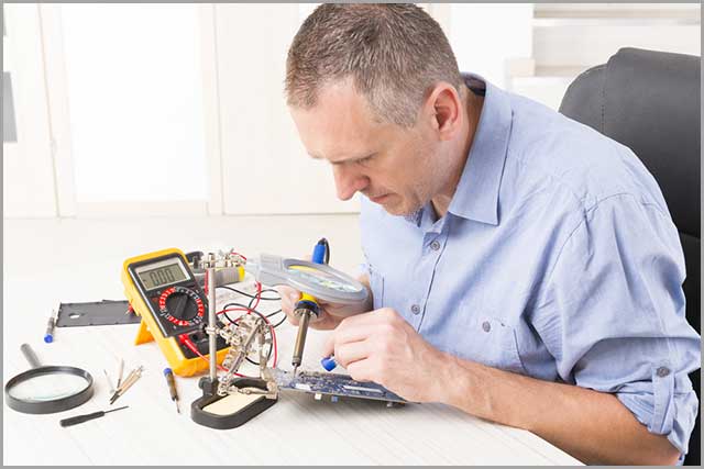 an engineer soldering a PCB.jpg