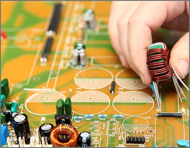 PCB mounting by human hands.jpg