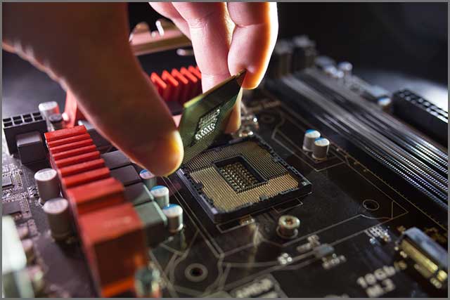 Technician plugging in an MSP430 microprocessor.jpg