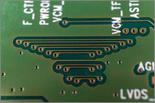It shows through-hole PCB vias and associated copper traces.jpg