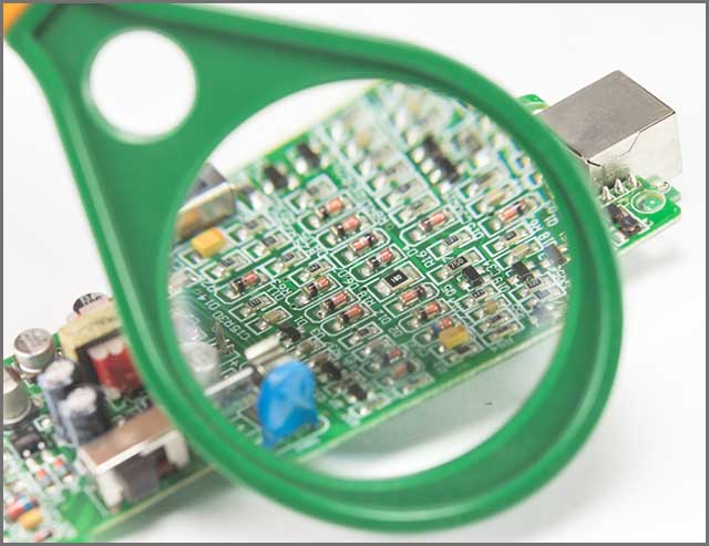 HDI PCBs-- Flexible PCB under a magnifier to reveal its components.jpg