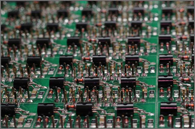 Close-up side view of a panel of SMD is located on the production of automatic control systems.jpg