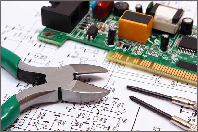 A PCB with electrical parts and precision tools.jpg