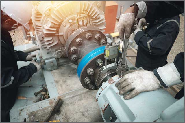 Staff checking and repairing alignment pump and electric motor.jpg