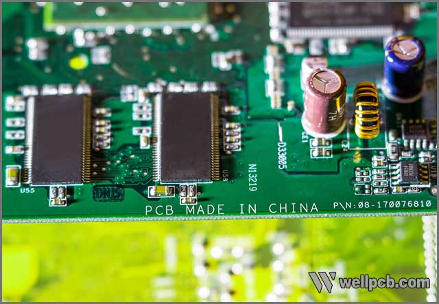 Chinese PCB manufacturers at the top of PCB industry, PCB MADE IN CHINA mark on a printed circuit board (PCB) closeup.jpg