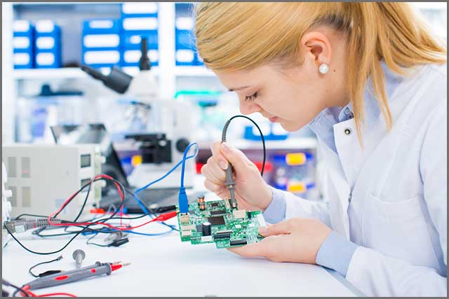 a lady inspecting thermal issues on a PCB).jpg