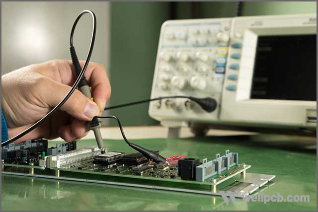 An engineer testing a multilayered PCB board.jpg