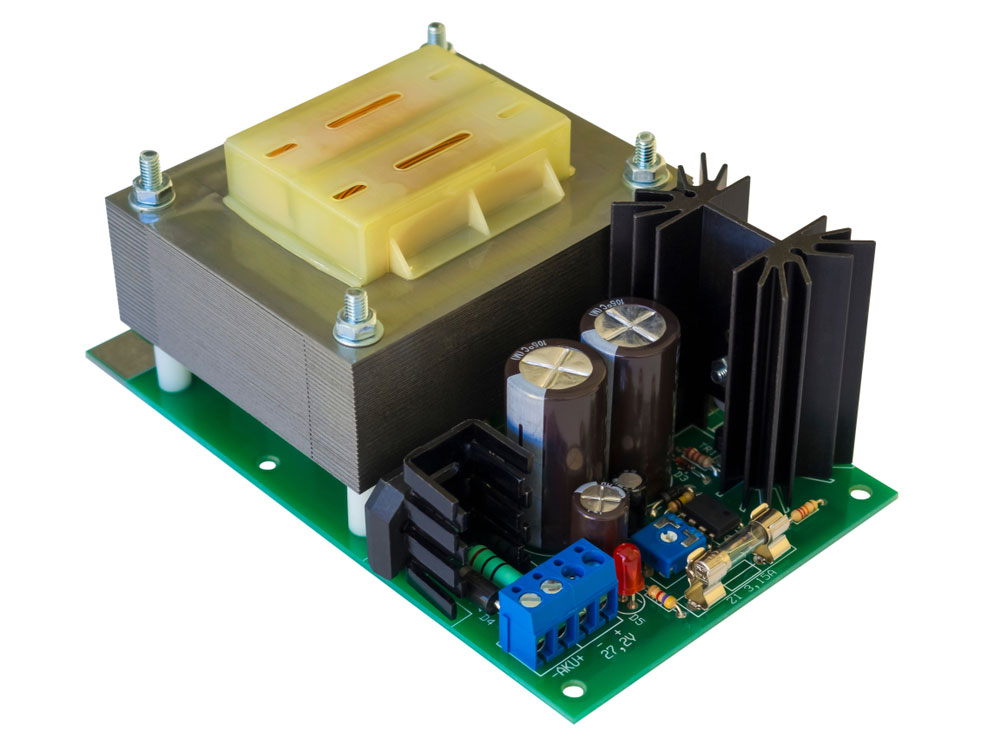 An AC-DC converter circuit board with a transformer and electronic components