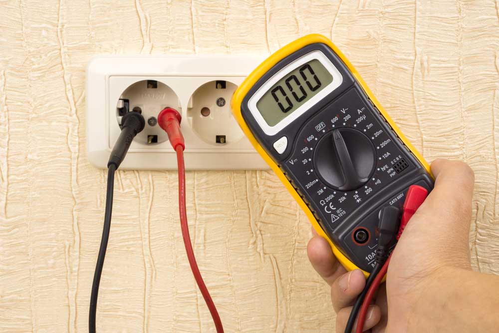 Electricians working on an electric meter