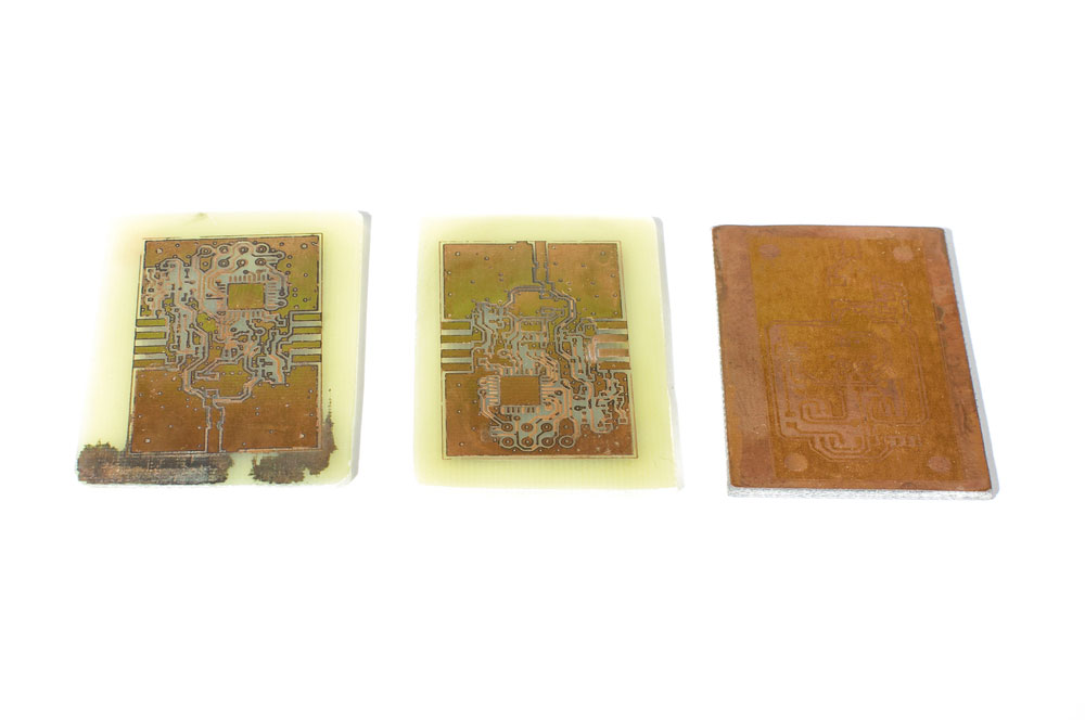 A collection of three copper printed circuit boards.  