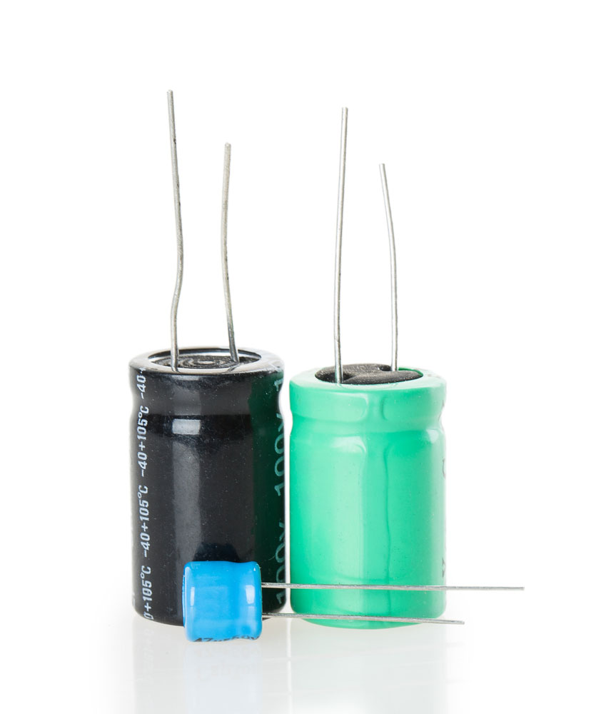 Image of three capacitors with different sizes and colors  