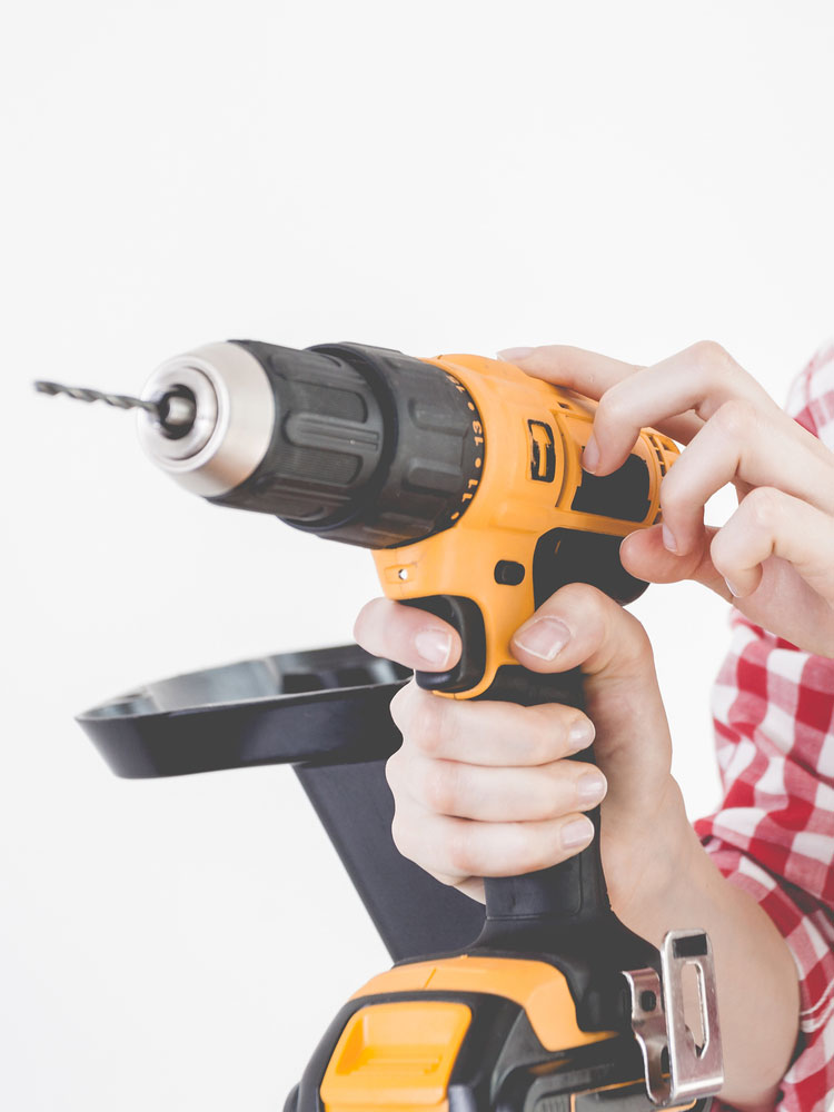 Use a power drill to create a hole