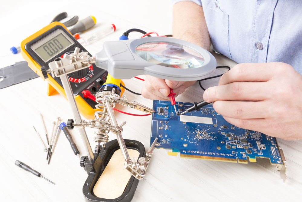 Technical staff use multimeter for testing