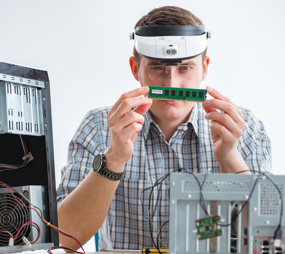 A technician repairing a computer