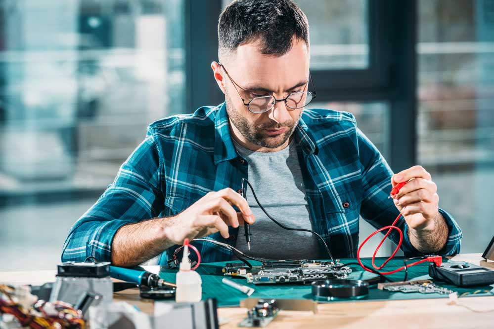 A Technician Fixing a Circuit
