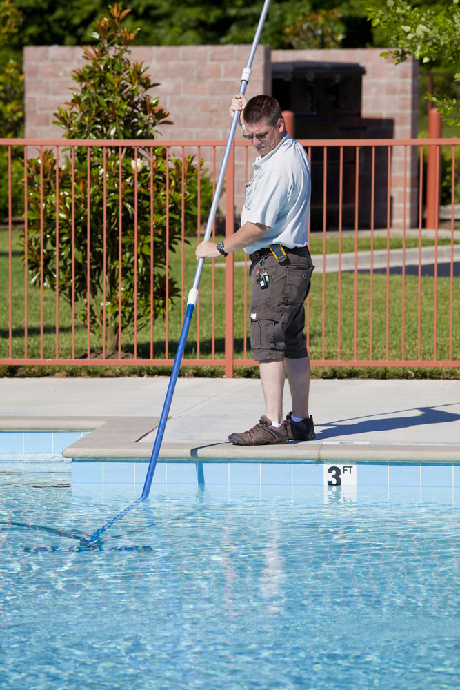 A Pool Expert conducting Routine Maintenance Practices