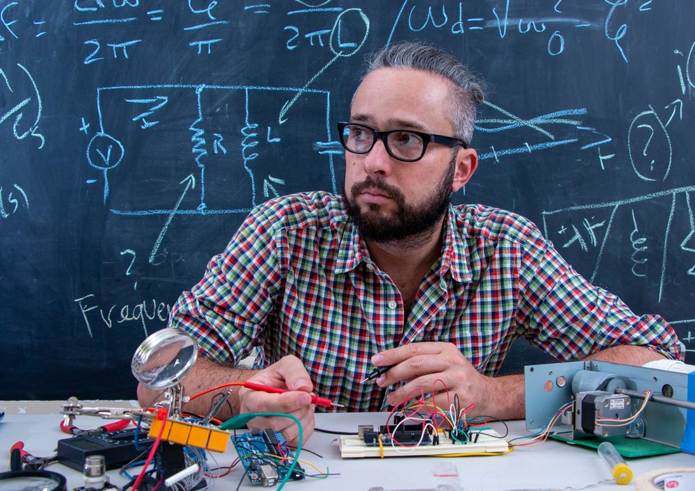 a technician is working on an electrical project