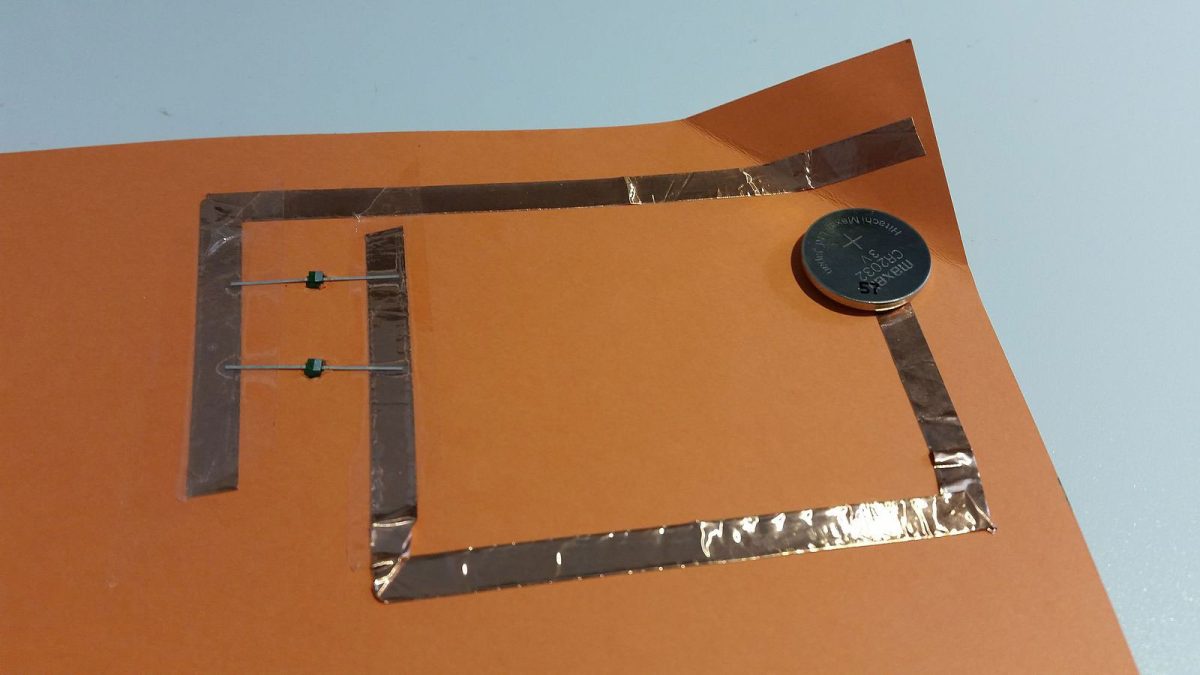 A paper circuit with a coin battery
