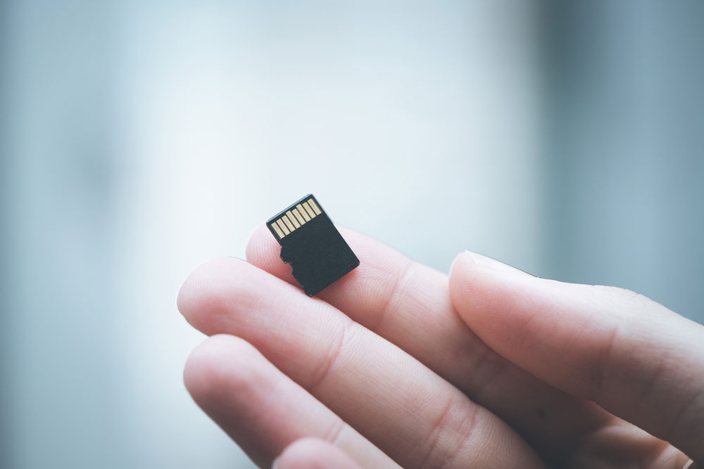 Hand holding a MicroSD card