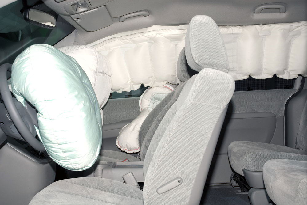 image of deployed airbags in a car. Car safety.