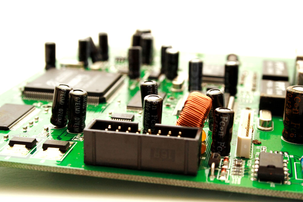 a picture of a green computer circuit board transistors