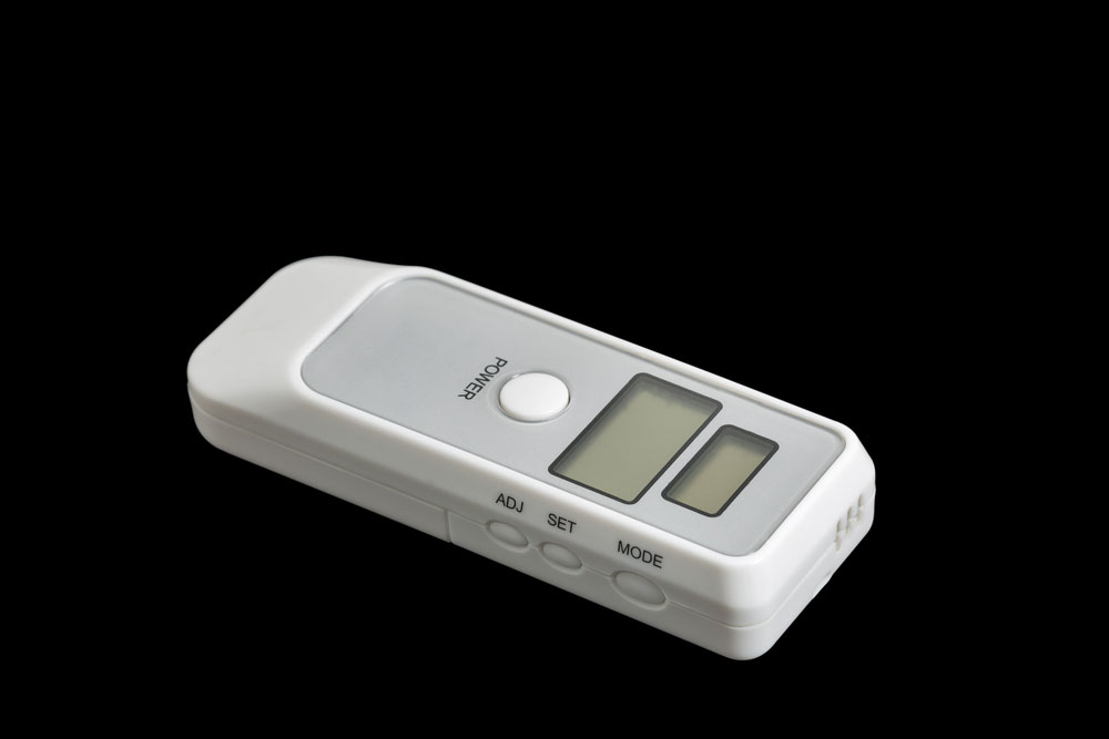 A portable breath alcohol tester