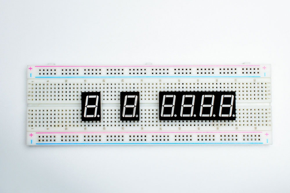 7-segment Arduino indicators attached to a breadboard.